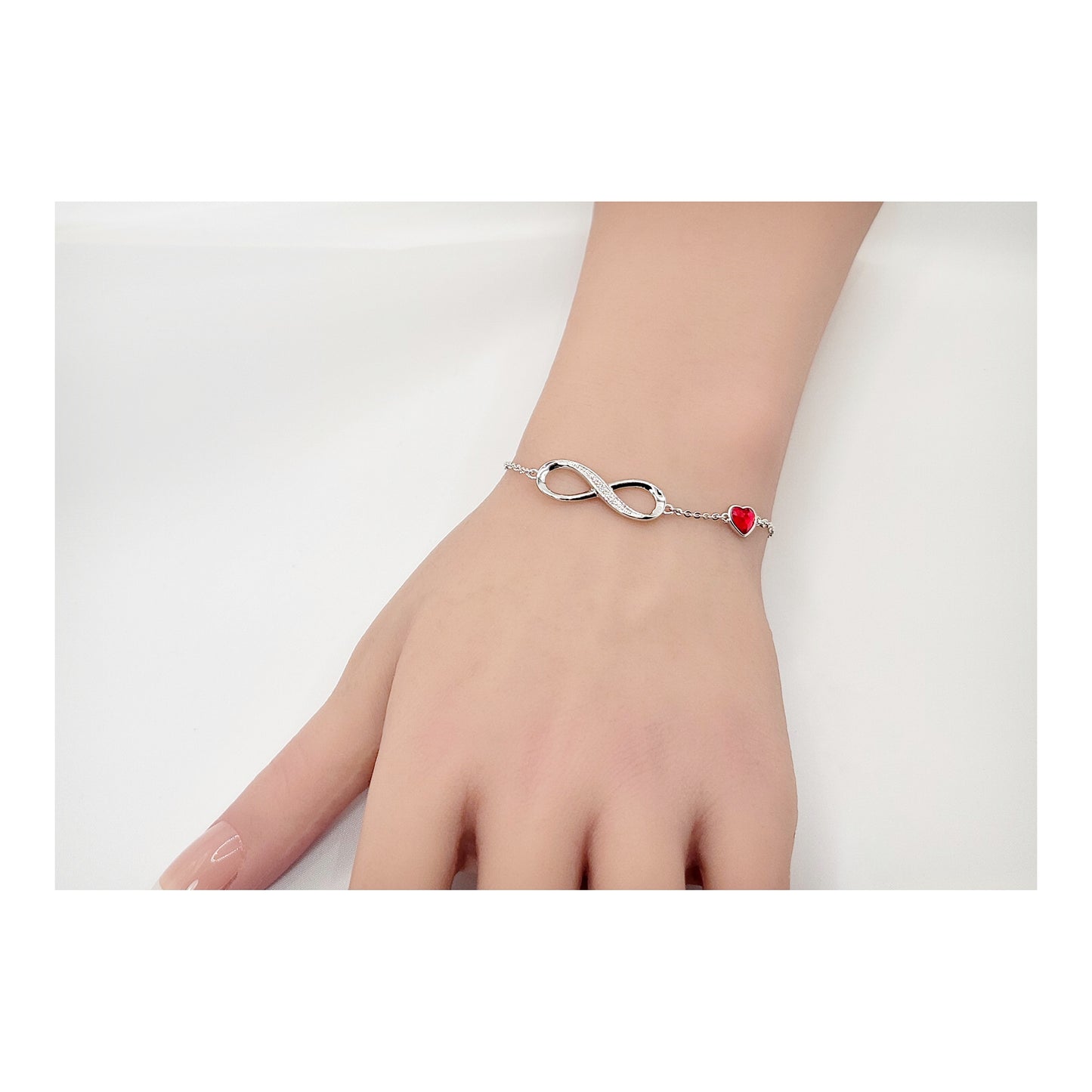 TIFFANY Figure Eight Austrian Red Crystal Heart Bracelet in Rhodium Over Sterling Silver