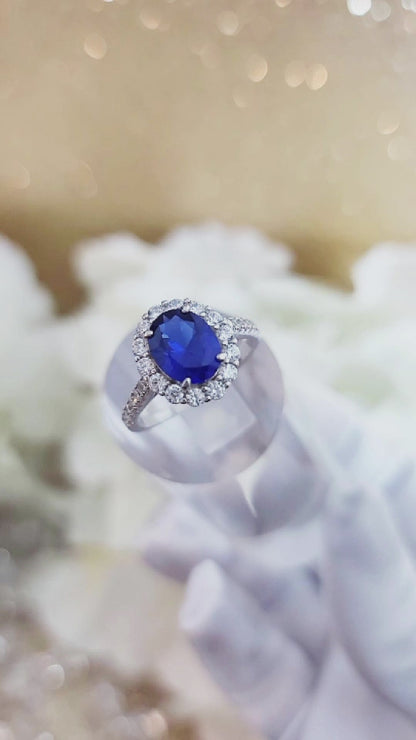 DIANA Oval Blue Sapphire Halo Ring in Rhodium Over Sterling Silver