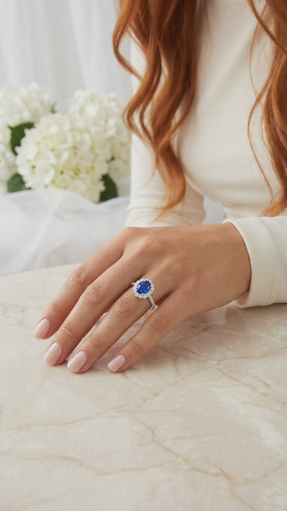 DIANA Oval Blue Sapphire Halo Ring in Rhodium Over Sterling Silver